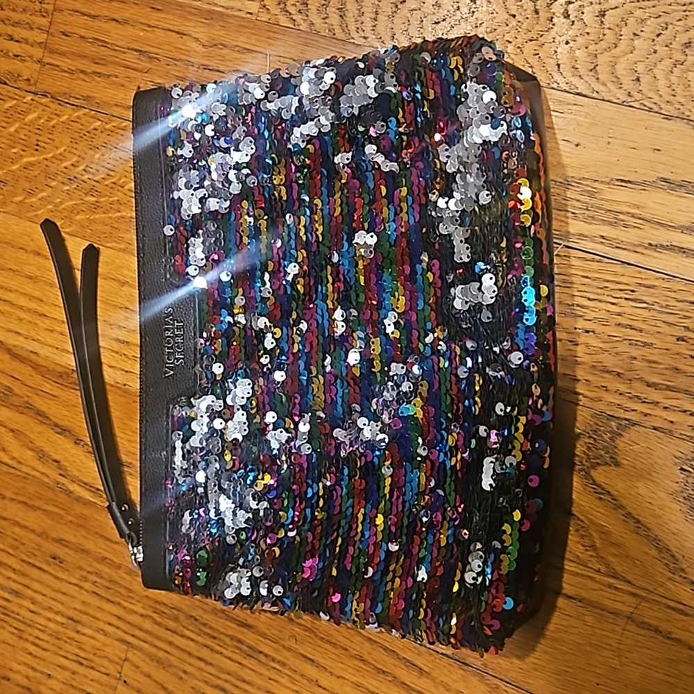 Victoria's secret makupbag or clutch. Colorful shiny front. Zipper closure